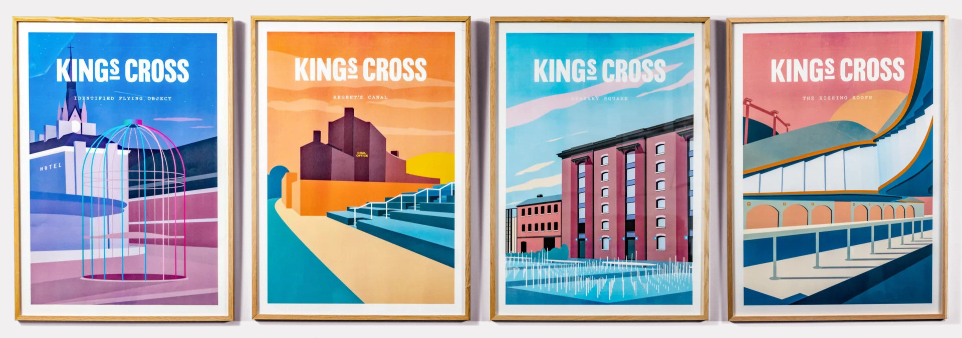 4 posters showing King's Cross scenes in flat colour blocks